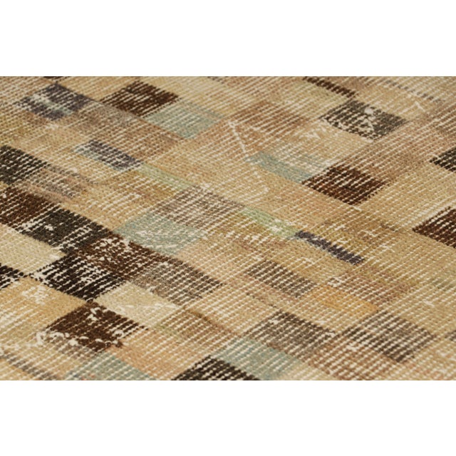 Hand-knotted in wool and originating from Turkey circa 1960 – 1970, this 3x5 vintage Zeki Müren rug is a unique addition...