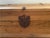Vintage wood chest with a bronze metal pulls on either end, bronze brackets and a bronze key latch that has broken....