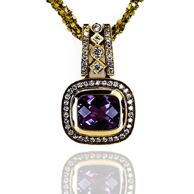 14k Pendant with 6.50 carat cushion cut amethyst and 1.13 carat of round brilliant diamonds 15.56 grams