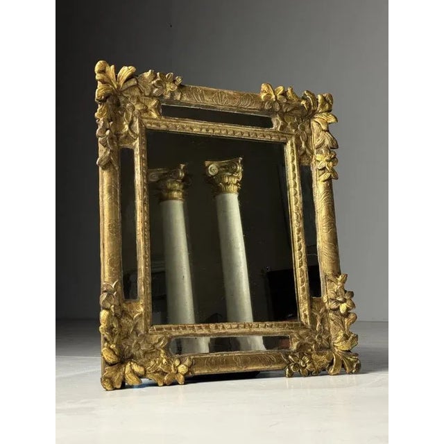 French louis xv period mirror (1715-1774) entirely gilded hand-carved wooden frame. One piece of mirror in frame is...