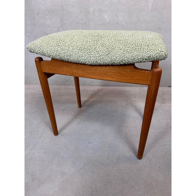 Vintage footstool or stool. Professionally fitted with new webbing, foam, and comfortable soft green upholstery. Spacious...