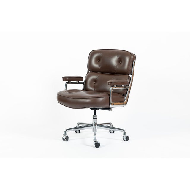 This brown leather Model 3475 Eames Time Life Executive Lobby Chair designed by Charles & Ray Eames for Herman Miller was...
