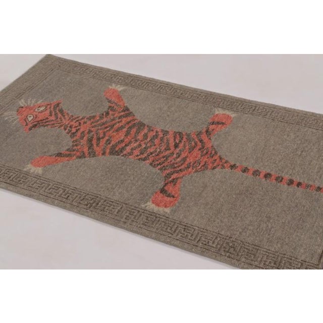 This striking 3x6 distressed pictorial runner is a bold, narrative work of art. Featuring a dramatic animal silhouette...