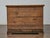 With its richly figured surfaces and architectural detailing, this English writing cabinet from the 19th century is full...