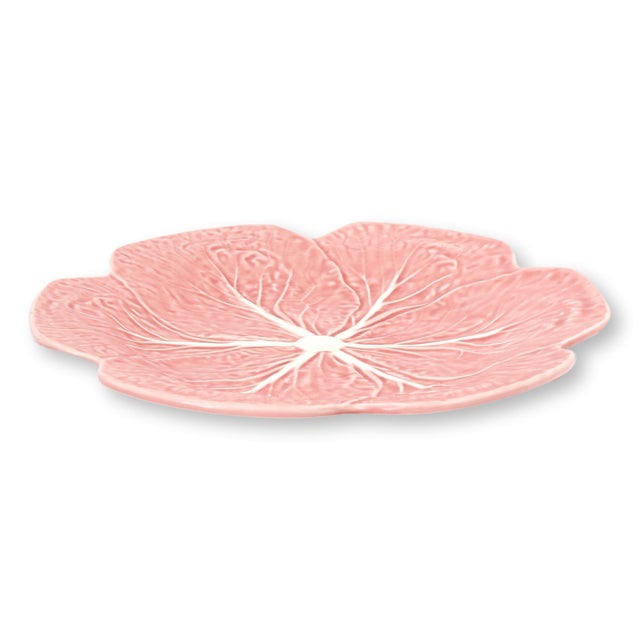 Pair of Portuguese Bordallo Pinheiro cabbage ware plates in an unusual and discontinued pink glaze. Molded in the iconic...