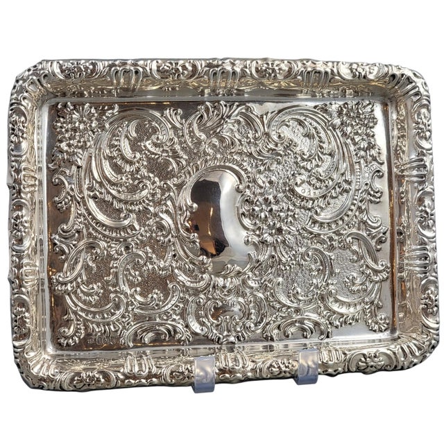 A finely worked Edwardian sterling silver card tray by Robert Pringle & Sons, hallmarked in London in 1904. The tray is...