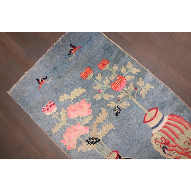 An early 20th-century Chinese Batou Small Rug in light blue