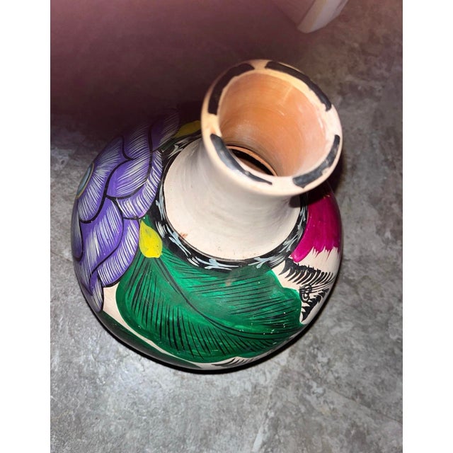 Vibrant Mexican style decorative vase. This somewhat primitive look vase is versatile in so many ways. It makes a great...