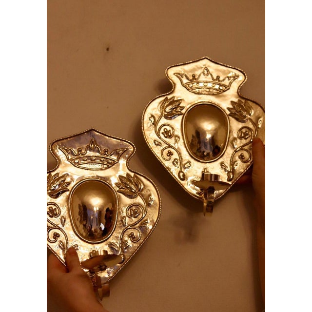 Made in Sweden A breath-taking mid-century duo of exquisite Swedish brass wall sconces, showcasing captivating hammered...