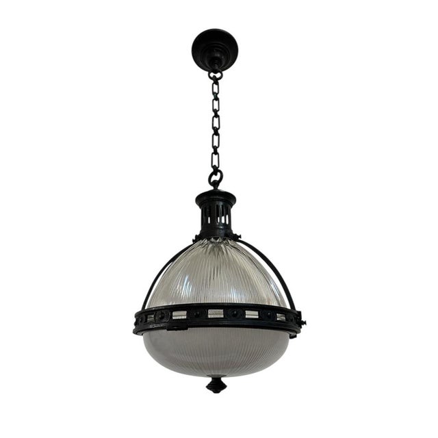 - An outstanding and extremely rare large caged Holophane pendant with original chain and ceiling rose, France circa 1920....