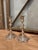 This is a pair of Victorian silver-plated candlesticks. It is designed in an ornate rococo style with curves, scalloped...