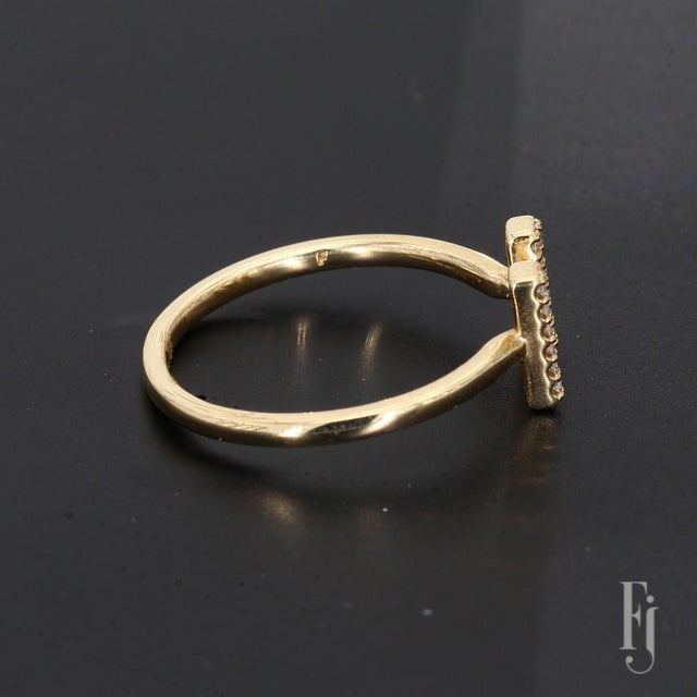 Here is a 14k Yellow Gold Ring featuring a Monogram "M" design adorned with Round White Diamonds. The primary diamonds...