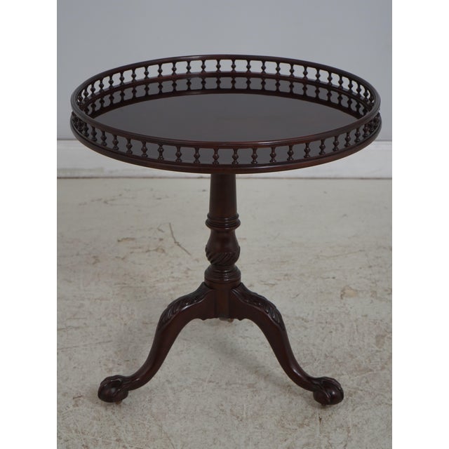 Age: Approx. 20 Years Old Details: Stately Homes Collection Tilt Top Brass Caster Feet Gallery Edge Dark Mahogany Finish...