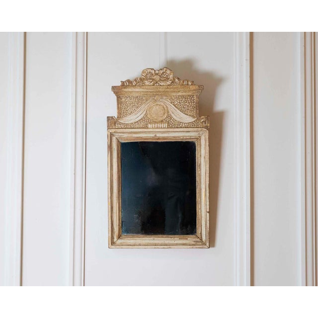 A small Gustavian mirror made in Sweden in the eighteenth century, this piece retains its original surface. Gustavian...