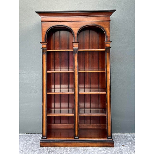 This magnificent arched etagere by Hickory White is a stunning example of Neoclassical-inspired furniture design, blending...