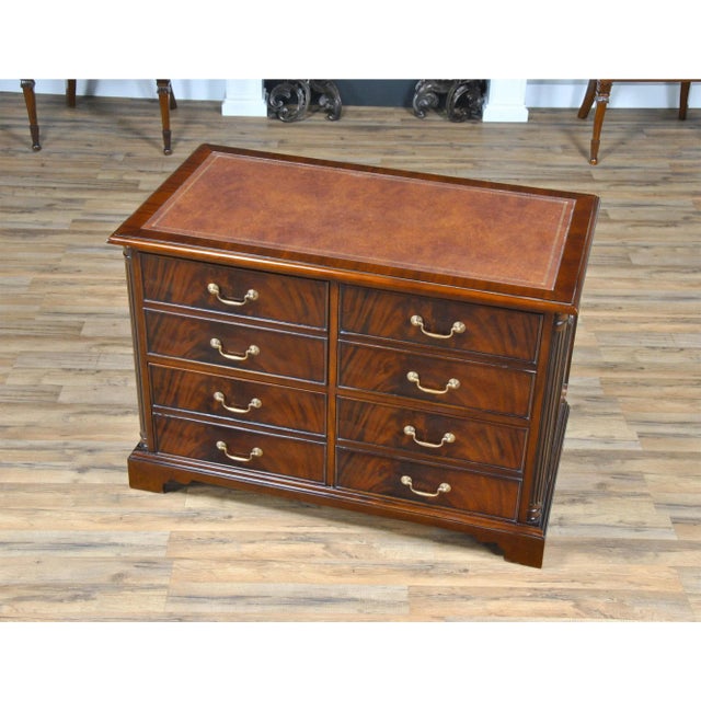 A highly functional and decorative piece this Four Drawer File cabinet is made with figured mahogany. The top of the...