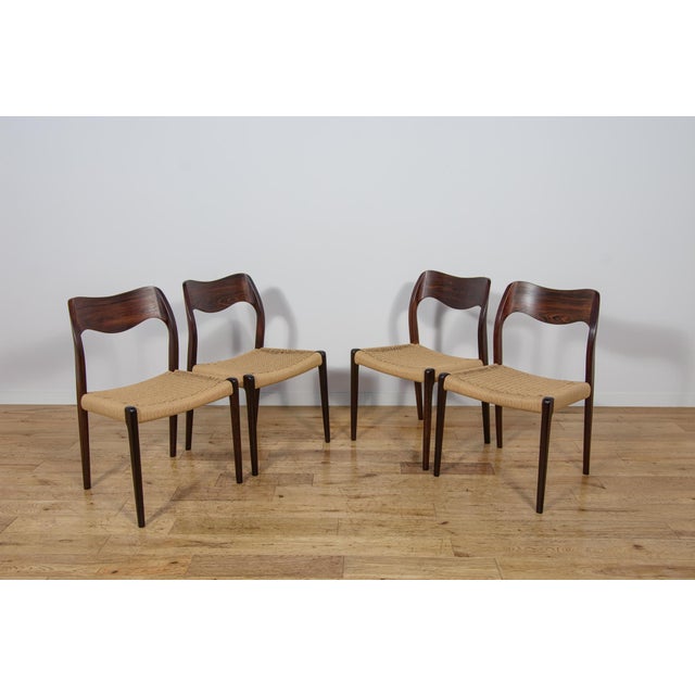 This set of four dining chairs was designed by Niels O. Møller and produced by J.L. Moller Mobelfabrik in Denmark during...