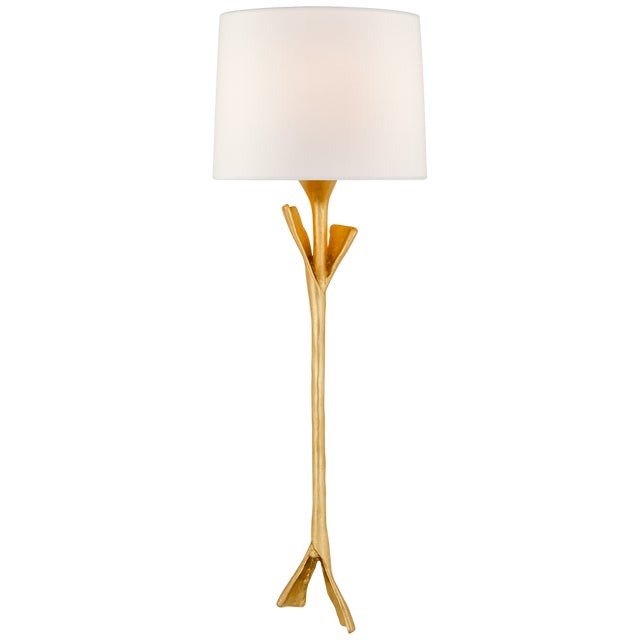 Fliana Tail Sconce in Gild with Linen Shade Designer: AERIN Height: 24" Extension: 5" Backplate: 4.25" x 5.5" Oval...