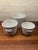 Set of 3 graduated sized vintage ceramic cachepot in basket form. Largest is 7” wide and 5 1/2” tall. Smallest is 5”...