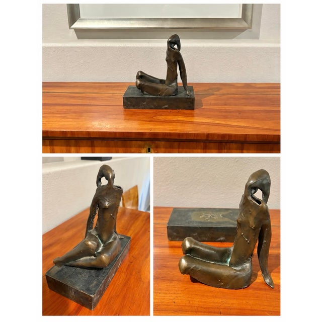 Bronze abstract female reclining nude sculpture resting on a custom metal base. (Optional use and included). Signed by the...