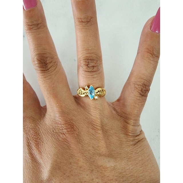 ♥ Product Summary ♥ Main Stone: Blue Topaz & Diamond Band Material: 14k Yellow Gold Stone Cut: Marquise/Round Width: 9MM...