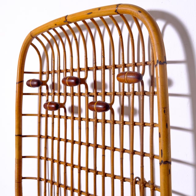 Beautiful Olaf Van Bohr coat rack, handcrafted from bamboo, rattan, and cane. Structure: It features a rectangular grid...