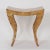 Swank Mid-Century bench or stool with a dramatic Egyptian influenced form and a hip crackled finish in variegated organic...