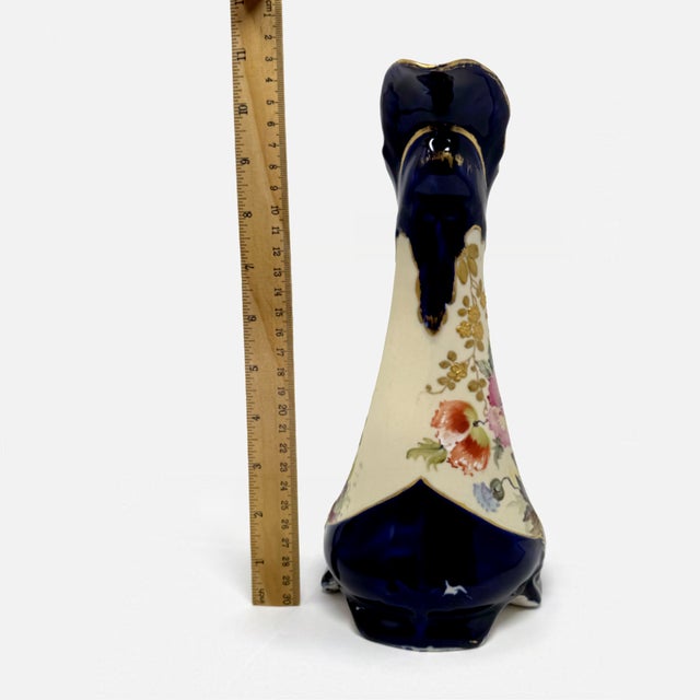 This stunning 10.5-inch tall decorative ewer (pitcher) features a rich, deep cobalt blue glaze that serves as a dramatic...