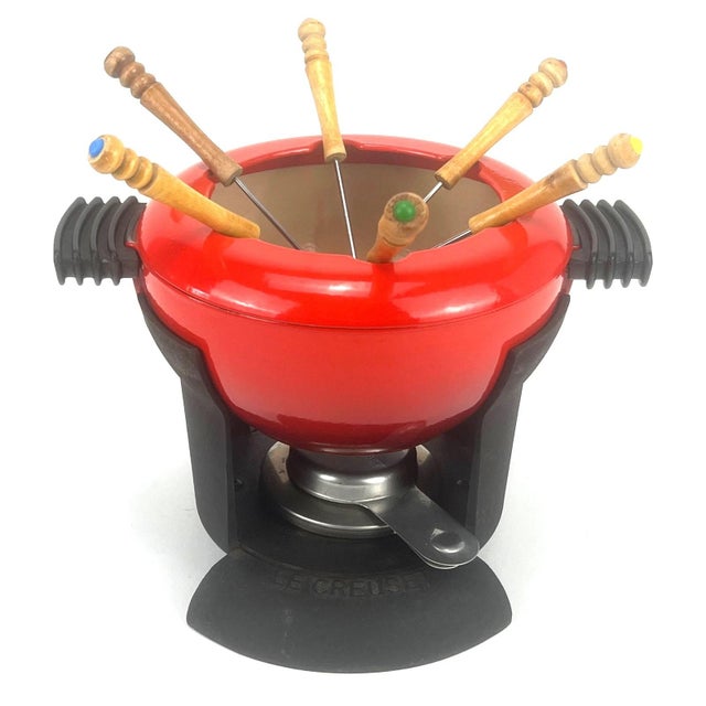Vintage Red Fondue Set in Enameled Cast Iron Cousances by Le Creuset, 1980s, in Very Good conditions. Designed 1980 to...
