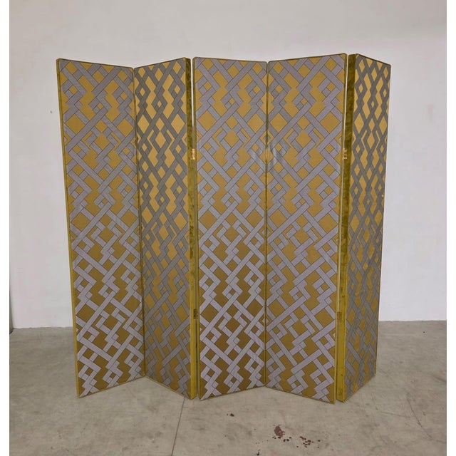 Hollywood Regency style screen, 1970s Large and refined five-panel padded room divider. Upholstered in green velvet with...