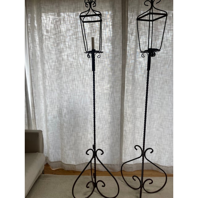 Early 1900's American torcheres in a burnished brown steel. The column is twisted/spiral iron. The candle holder is 1 1/2"...