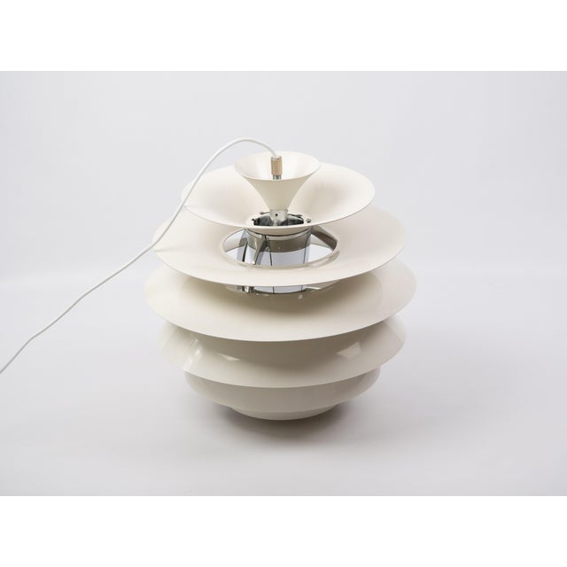 The Snowball pendant lamp is one of the most recognizable designs by Danish designer Poul Henningsen. Designed in 1958 for...