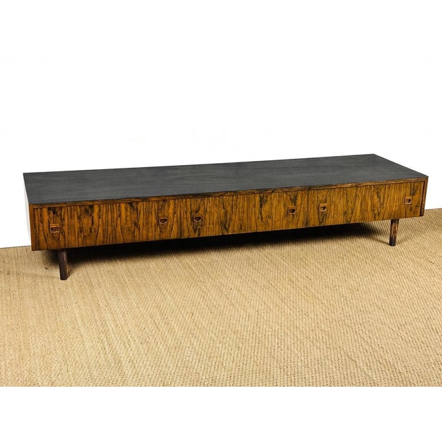 An elegant scandinavian/vintage sideboard in rosewood with clean, low lines, typical of mid-century design from the 1960s....