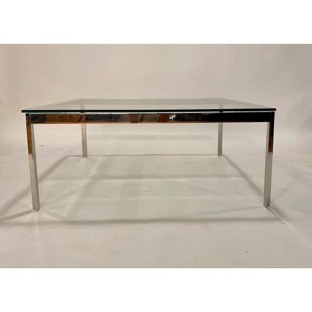 Vintage modern steel and glass square coffee table in the style of Milo Baughman or Knoll crafted in knife edge corners.