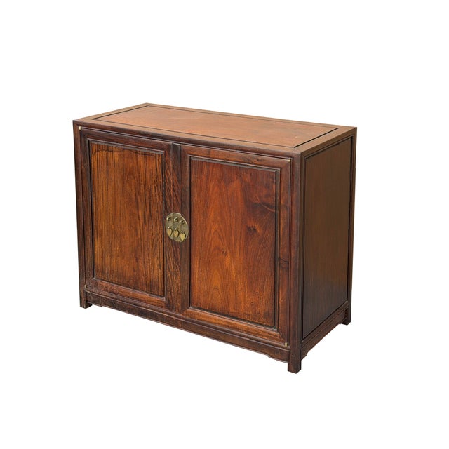 This elegant Chinese hardwood side cabinet—likely crafted from a richly grained timber such as huanghuali or...