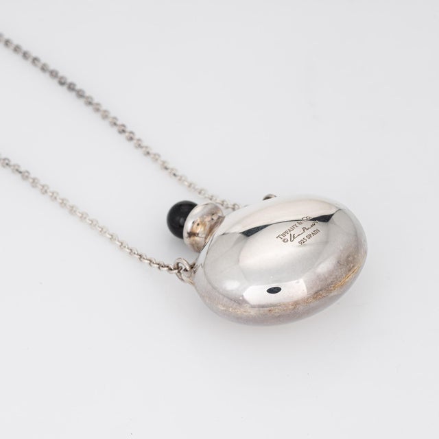 Stylish estate Tiffany & Co Elsa Peretti round bottle necklace crafted in sterling silver. The bottle necklace is a...