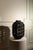 Add a touch of rustic sophistication to your space with this striking woven wood lantern. Handcrafted with a textured,...