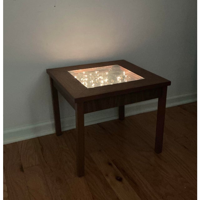 Vintage Mid-Century Modern accent infinity table with lights. Features walnut frame with center mirror glass top, plug in...