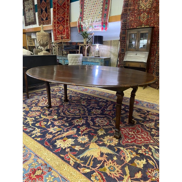 High quality make on this vintage 100% English made oak oval Drop leaf dining table. Can also be used as a sofa table with...