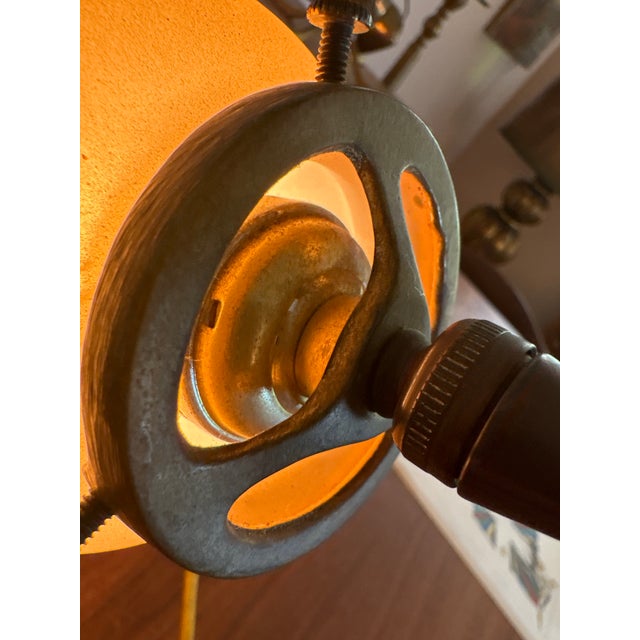 Striking vintage desk lamp featuring a sculptural bronze-tone metal base paired with a beautifully glowing satin glass...