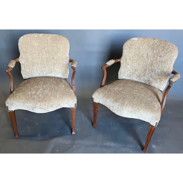 Very handsome pair of 19th century Georgian style mahogany armchairs with tapered and molded legs. There are 2 pair...