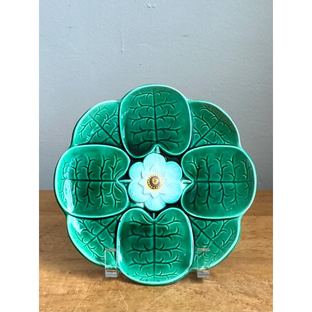 This vintage majolica lily pad plate epitomizes the exuberant, nature-inspired decorative tradition of 19th-century...