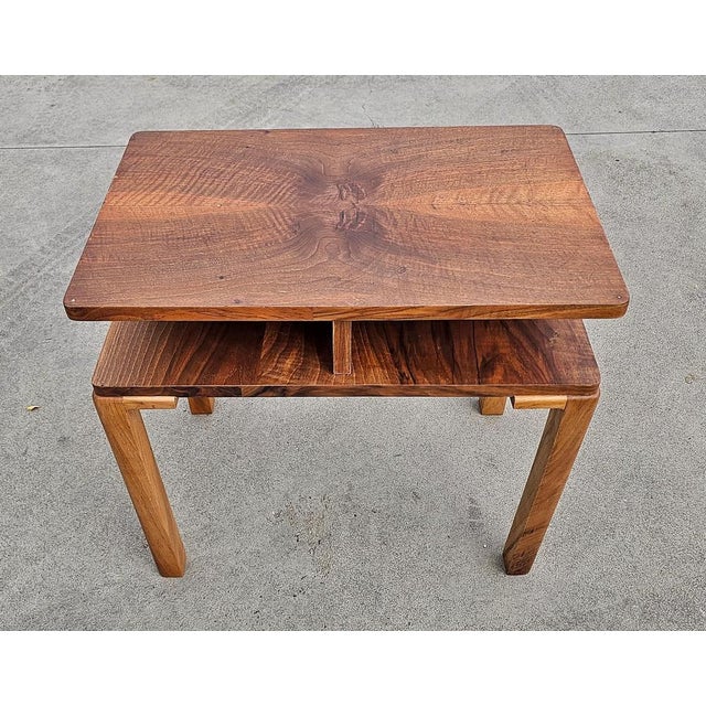 In this listing you will find a gorgeous rectangular Art Deco side table done in walnut, with very rich wood patterns. It...