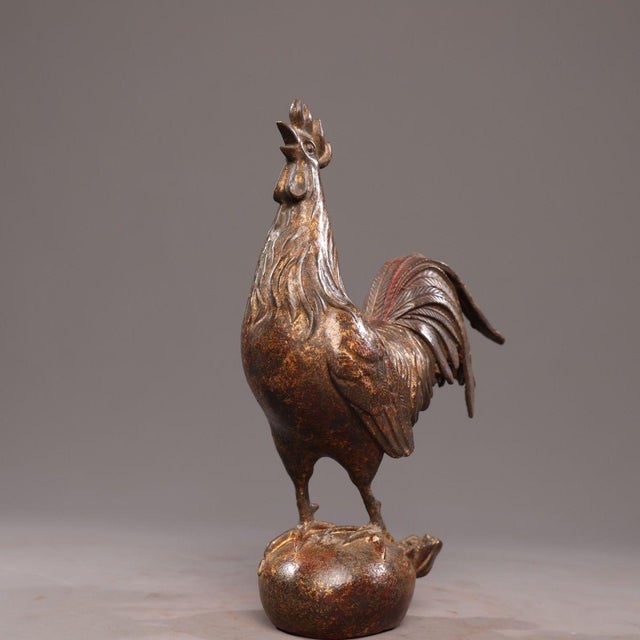 This charming sculpture depicts a rooster, a traditional symbol of punctuality, fidelity, and good fortune. The figure is...
