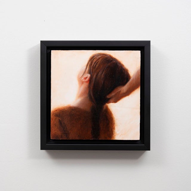 This intimate oil painting captures a moment of stillness as a hand gently holds a braid of hair, evoking a sense of...