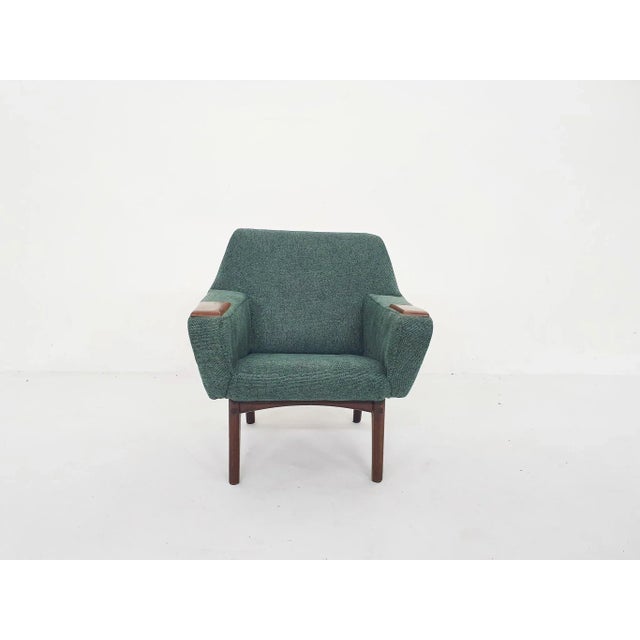 About this item Small lounge chair for kids or for dolls. Re-upholstered in a green fabric. With teak legs and arm rests.