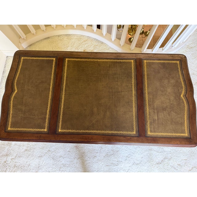 A Striking Mid-Century French Provincial Writing Desk crafted by Sligh Furniture Co. of Holland Michigan. This piece...