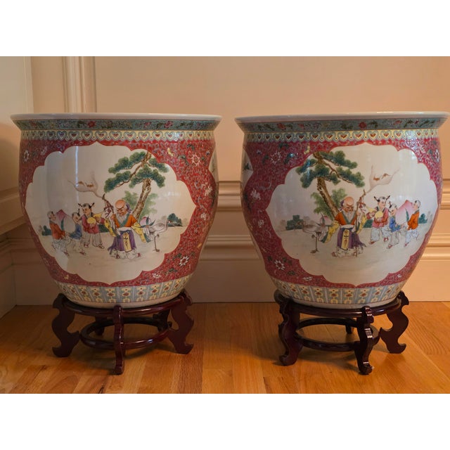 Chinoiserie Mid-20th Century Chinese Ruby Ground Famille Rose Fish Bowls on Carved Stands - A Pair For Sale - Image 3 of 8