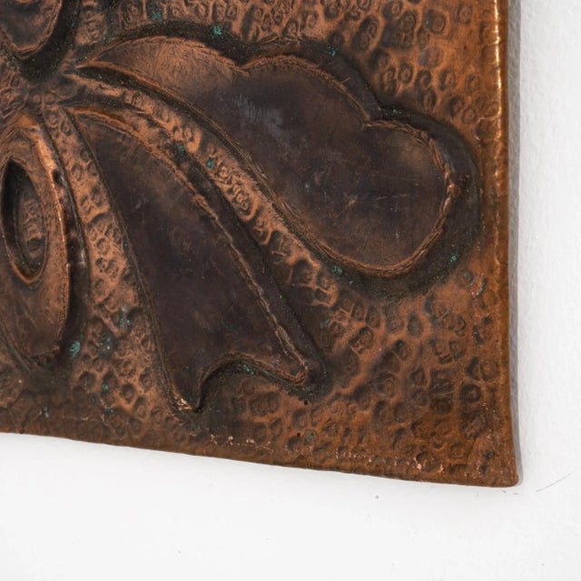 Graphic and eye-catching, this copper wall decoration makes a unique vintage accent. The square plaque is decorated with a...