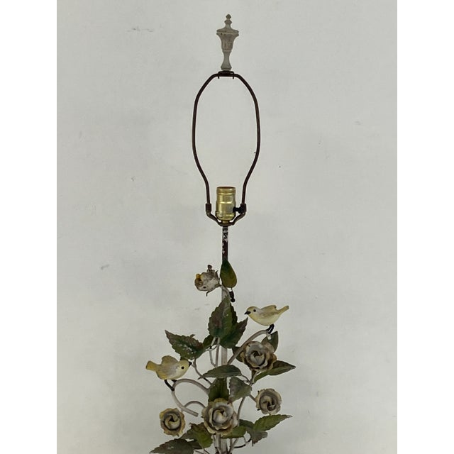Vintage Italian tole table lamp made in the 1950s. Features two small yellow birds perched among hand-formed metal roses...